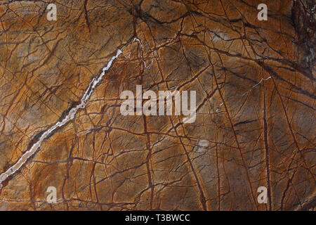 Background natural stone marble brown with an interesting pattern called Bidasar Brown. Stock Photo