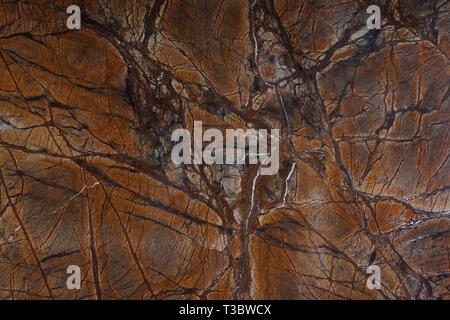 Background natural stone marble brown with interesting veins called Bidasar Brown. Stock Photo