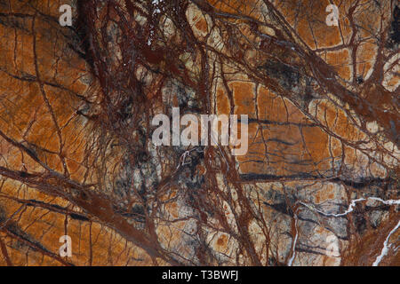 Background natural stone marble brown with interesting dark streaks is called Bidasar Brown. Stock Photo