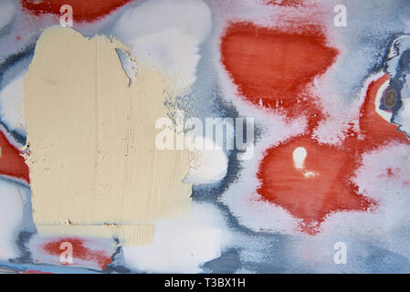 Background of a irregularly painted wall in different colors. Stock Photo