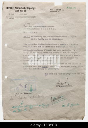 Reinhard Heydrich, a signed document from 1940 Typewritten letter to the head of the SS human resources department, SS-Gruppenführer Schmitt, requesting to authorise the promotion of SS-Standartenführer Karl d'Angelo to SS Oberführer. Handwritten ink signature 'Heydrich', printed heading 'The head of the security police and the SD', date stamp of the SS human resources department, the pencil inscription 'commanding police director of Cuxhaven' and further notes in green indelible pencil, probab historic, historical, 1930s, 20th century, Waffen-SS, armed division of the SS, , Editorial-Use-Only Stock Photo