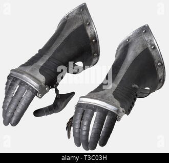 A pair of German black and white fingered gauntlets, circa 1580 Articulated metacarpus of five lames with raised cabled knuckle protection. Articulated finger defences and hinged thumb plates. Pointed cuffs set with turned under and roped edge. An armoury mark consisting of three dots at the edge. Length 35 cm each. historic, historical, 16th century, defensive arms, weapons, arms, weapon, arm, fighting device, object, objects, stills, clipping, clippings, cut out, cut-out, cut-outs, utensil, piece of equipment, utensils, plating, armour-plating,, Additional-Rights-Clearance-Info-Not-Available Stock Photo