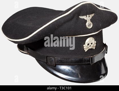 A visor cap for SS enlisted men/NCOs, early model Cap body of black woolen material with white piping and silver-plated metal insignia in the early form, three-piece patent leather chinstrap. Inner liner of brown cotton and oil cloth. Leather sweatband. Size 56. Ordinarily, these early pieces did not carry SS or RZM markings. historic, historical, 1930s, 1930s, 20th century, Waffen-SS, armed division of the SS, armed service, armed services, NS, National Socialism, Nazism, Third Reich, German Reich, Germany, military, militaria, utensil, piece of equipment, utensils, object, Editorial-Use-Only Stock Photo