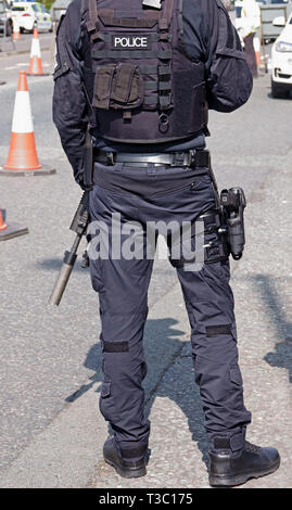 Heavily armed UK police officers on duty at the 2019 Aintree Grand National Meeting Stock Photo