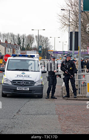 Heavily armed UK police officers on duty at the 2019 Aintree Grand National Meeting Stock Photo