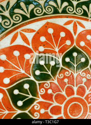 Vivid orange and dark green colored painted stone table top for background Stock Photo