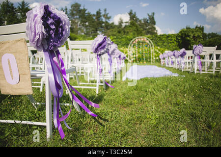 Flowers decorate a beautiful wedding arch Stock Photo