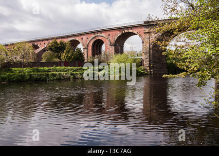 A scenic view of the River Tees at Yarm  showing the rail viaduct and tree lined river banks Stock Photo