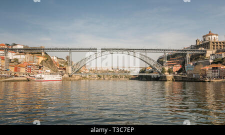The double decked arched Dom Luis I Bridge across the River Douro in Porto, Portugal. Stock Photo