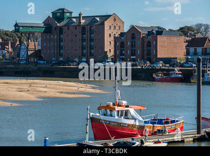 Port and Harbour of Wells-next-the-Sea with distinctive old granary building, Norfolk, United Kingdom. Stock Photo