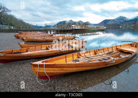 Rowing boats by Derwentwater pier, Keswick, Cumbria Stock Photo