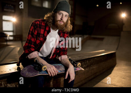 Skater Sitting on Ramp Stock Photo