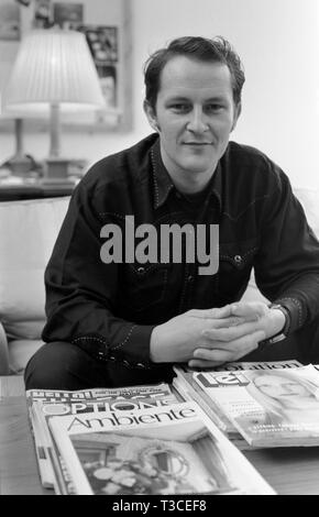 Nick Ashley when he was Head of Design at Laura Ashley, sitting in his office in London, UK 1988 Stock Photo