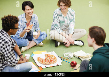 Students eating pizza Stock Photo