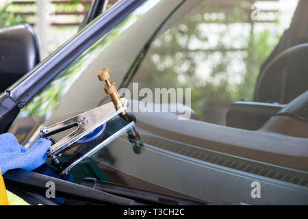 Using tools repairing to fix crack windshield Stock Photo