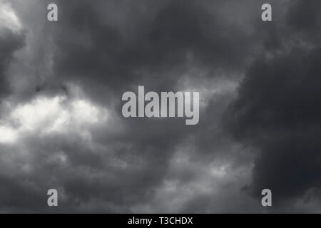 Dark and Dramatic Storm Clouds Area Background Stock Photo