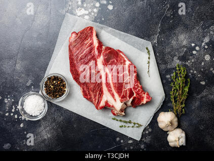 Fresh and raw beef meat. Whole piece of red meat ready to cook on the grill or BBQ. Top view, place for text. Concept of summer food Stock Photo