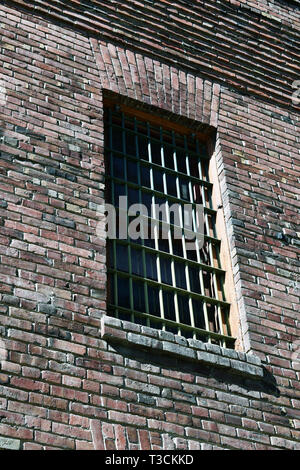 Old brick building with steel bars in window Stock Photo - Alamy