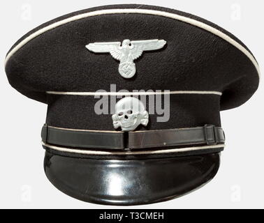 A visor cap for SS enlisted men/NCOs, for the black uniform Wartime production of black gabardine with white piping, a black visor with the SS-RZM stamp on the bottom, three-piece, black lacquered leather chinstrap, aluminium insignia, and brown linen and oilcloth lining with gold runes stamped under the maker's label in the top and a sewn-in SS-RZM label 'Vom Reichsführer-SS befohlene Ausführung' (Model Specified by the Reichsführer-SS). Black RZM label, 'Tuchmütze für SS' (Cloth Cap for SS), under the brown leather sweatband. Practically new, unworn condition. historic, h, Editorial-Use-Only Stock Photo