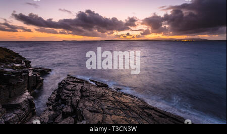 Dusk view to Flotta and Hoy across Hoxa Sound from Hoxa Head, South Ronaldsay, Orkney Islands. Stock Photo