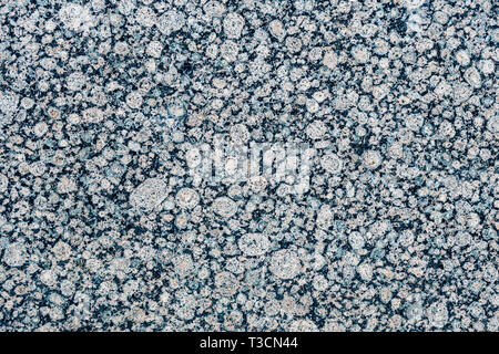 Close up of a gray granite wal tevture - image Stock Photo
