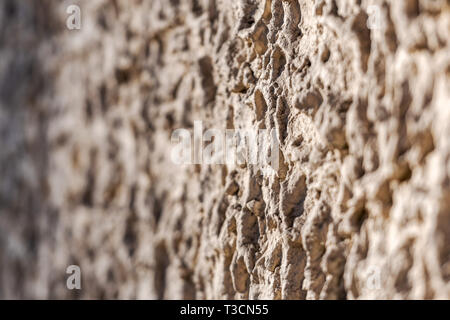 Decorative exterior wall plaster with embossed surface. Selective focus  image Stock Photo