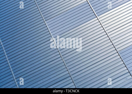 Abstract architectural background from modern buildings facade with blue and silver lines - image Stock Photo