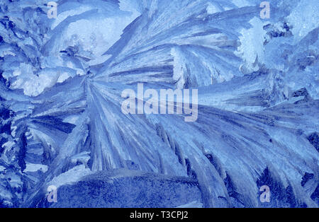 Blue frost on a cabin window in Sawtooth Valley, ID Stock Photo