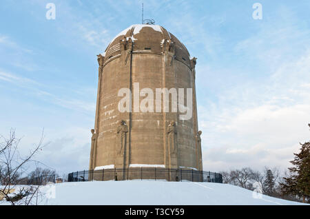 historic landmark water tower listed on national historic register atop snow covered  hill in tangletown neighborhood of minneapolis minnesota Stock Photo