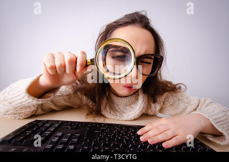 Funny nerd girl working on computer Stock Photo