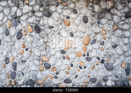 Wall made of gravel and cement. Backgrounds, Textures Stock Photo