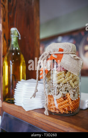 Cereal pots and breakfast bowls in a hotel on wooden board Stock Photo