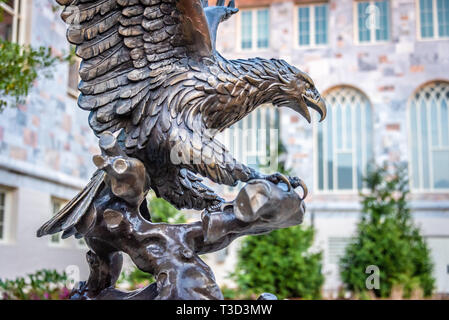 Bronze eagle sculpture (tribute to the generosity of Sims Garrett, Jr.) near Candler School of Theology on the campus of Emory University in Atlanta. Stock Photo