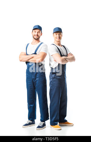 two smiling movers in uniform with arms crossed looking at camera on white Stock Photo