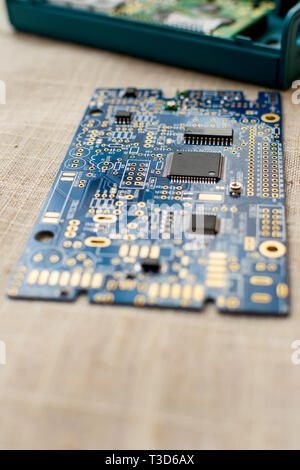 Circuitboard with resistors microchips and smd electronic components - selective focus Stock Photo