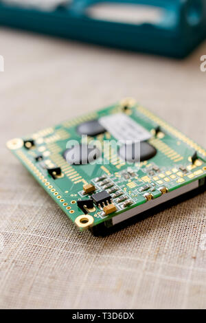Circuitboard with resistors microchips and smd electronic components - selective focus Stock Photo