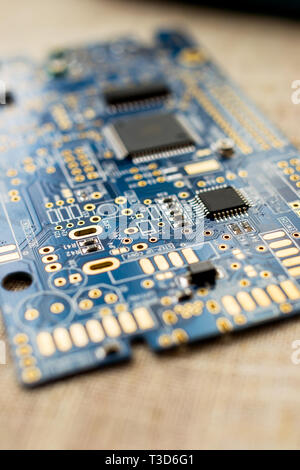 Circuitboard with resistors microchips and smd electronic components - selective focus Stock Photo