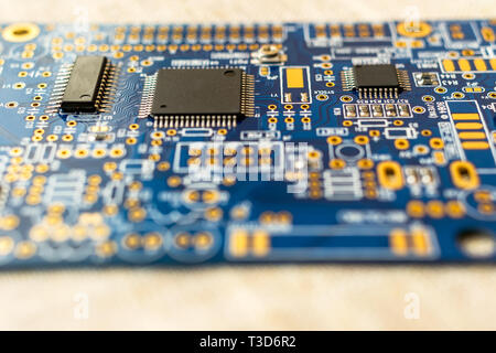 Circuitboard with resistors microchips and smd electronic components - selective focus Stock Photo