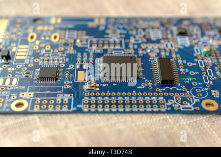 Circuitboard with resistors microchips and smd electronic components - selective focus Stock Photo