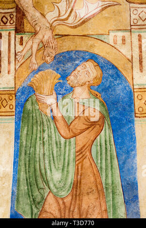 Cain holds up a sheaf to God Father and his sacrifice is refused by a ...