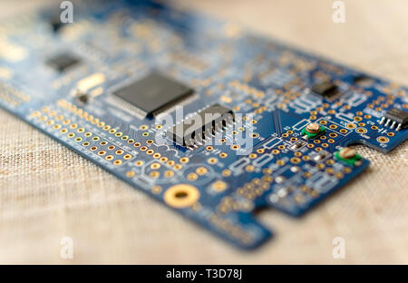 Circuitboard with resistors microchips and smd electronic components - selective focus Stock Photo