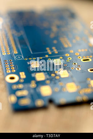 Circuitboard with resistors microchips and smd electronic components - selective focus Stock Photo