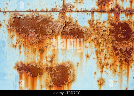 Texture of old rusty metal, painted white which became orange spots from rust. Horizontal texture of paint on rustic steel Stock Photo