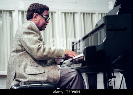 Jazz Pianist Billy Taylor teaches a music class and plays the piano. Stock Photo