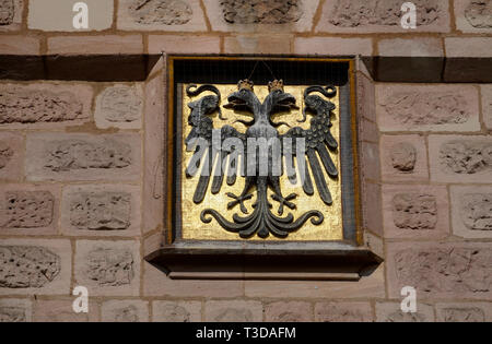 Imperial coat of arms at Craftsmen court (german: Handwerkerhof), old town of Nuremberg, Franconia, Bavaria, Germany Stock Photo