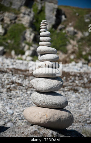 Balancing Pebble Tower on the beach. Stock Photo