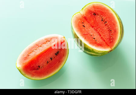 pieces of juicy watermelon on a pastel blue background Stock Photo