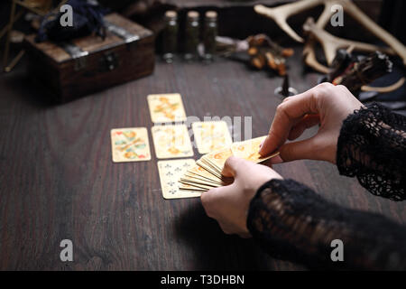 Solitaire and prediction. The fairy spreads the cards. The clairvoy arranges solitaire. Stock Photo