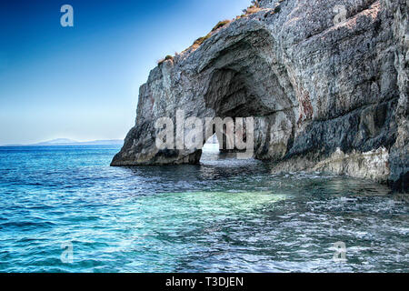 Blue caves on the sea in Zakynthos in Greece. Clear water of medditerian sea in sunny day at summer. Stock Photo