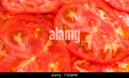 tomato sliced by circles Fresh healthy cutted vegetables , Garden tomato background Stock Photo
